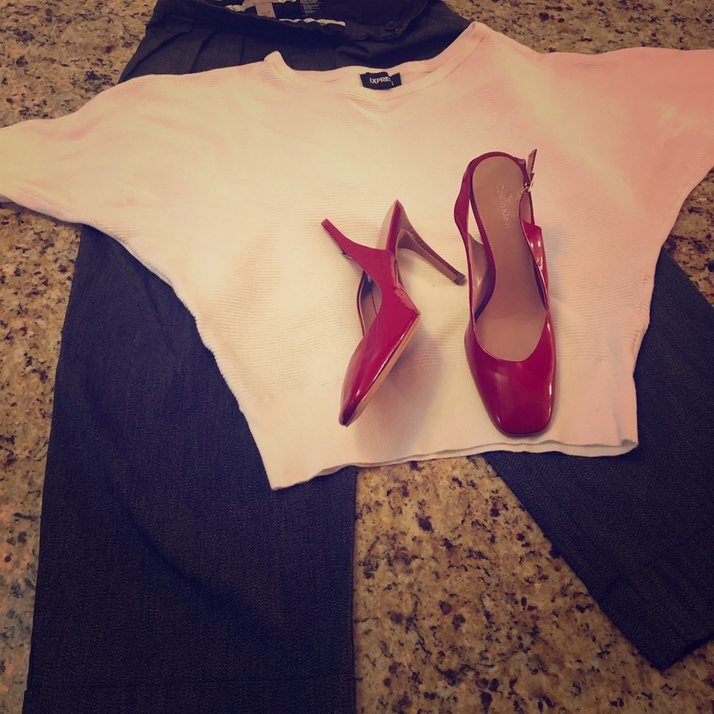 Crop top, pants and sling back shoes.